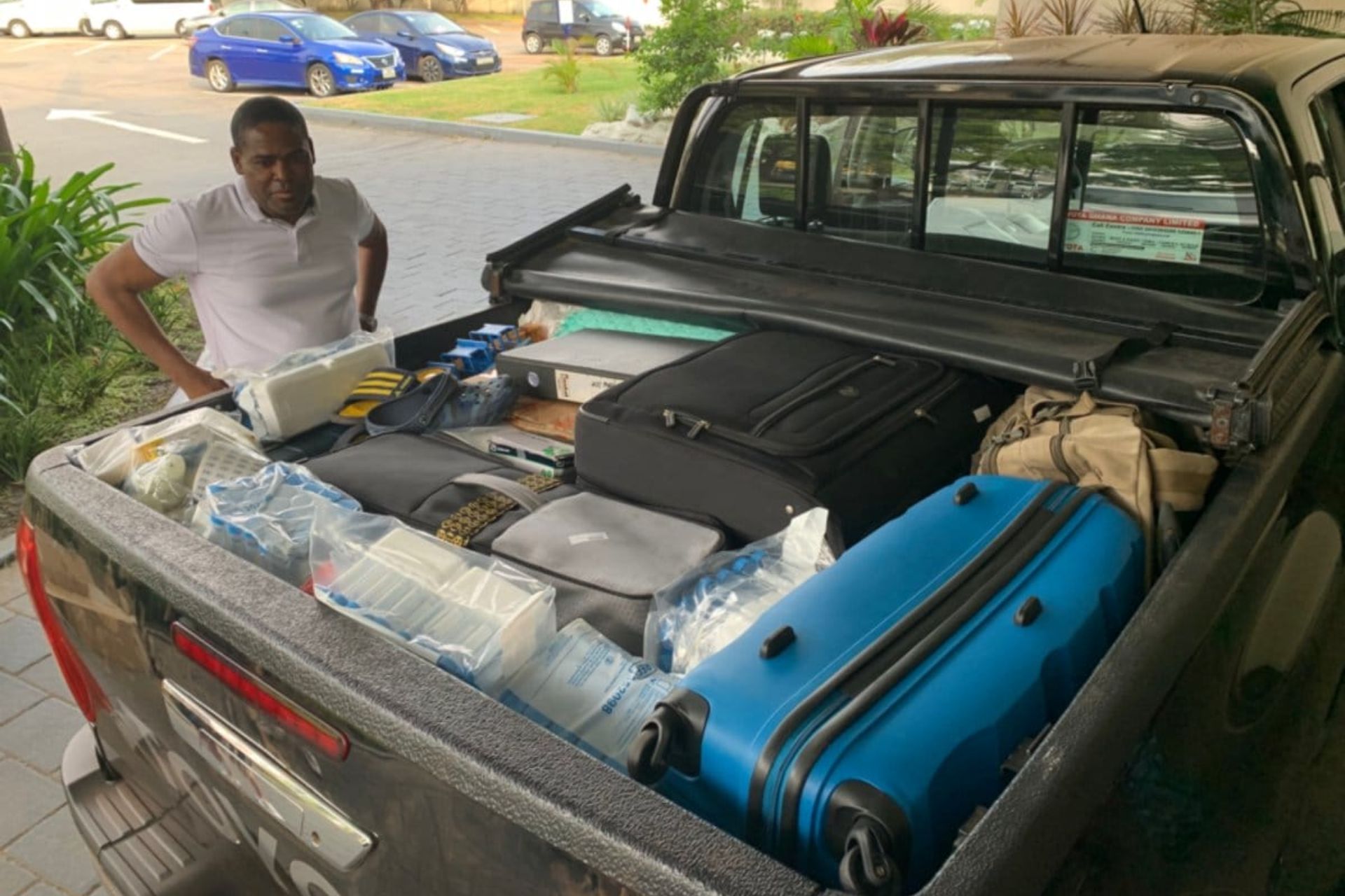 Researcher loads truck with scientific equipment in Accra