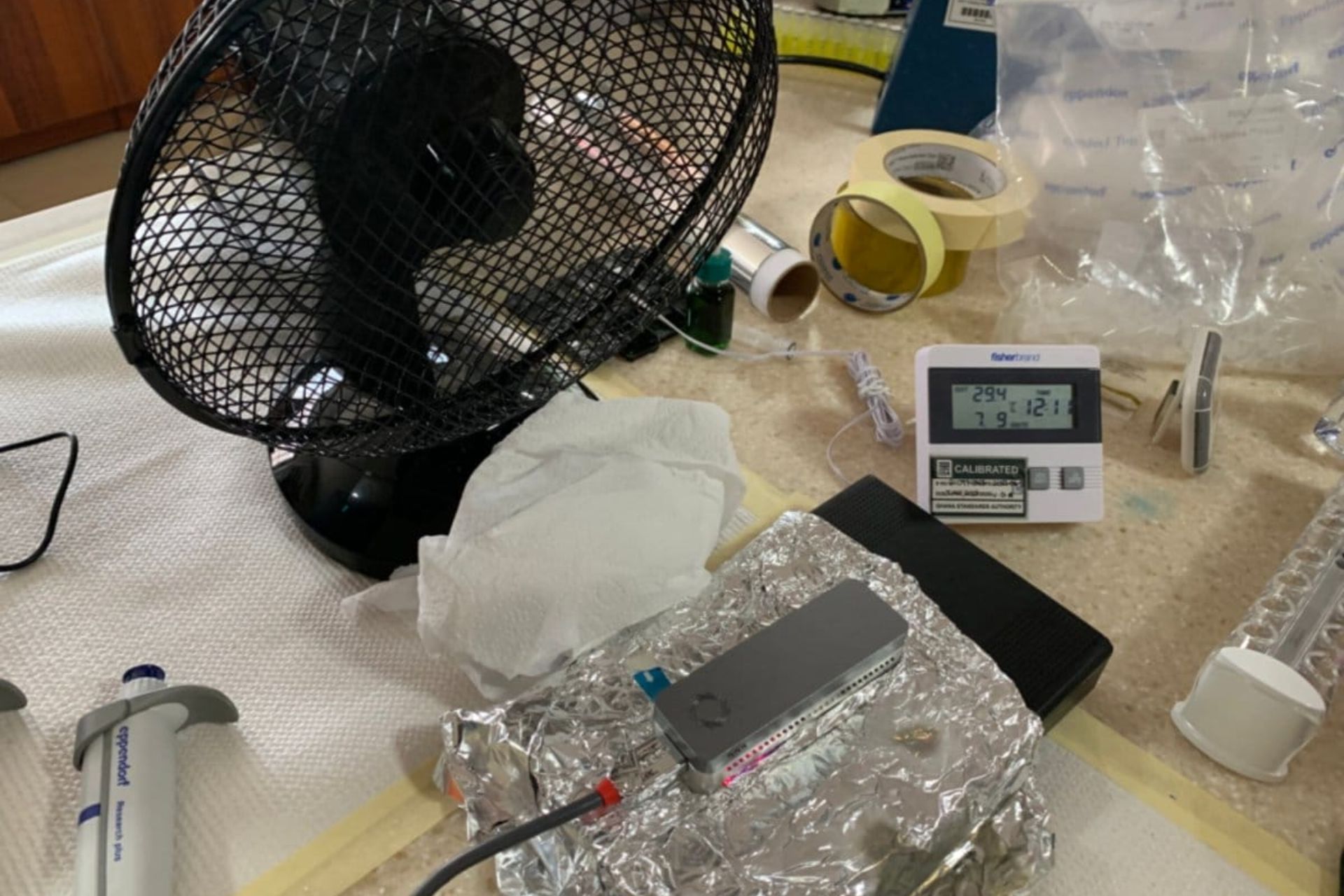 Fan and tin foil helping to cool a DNA sequencer