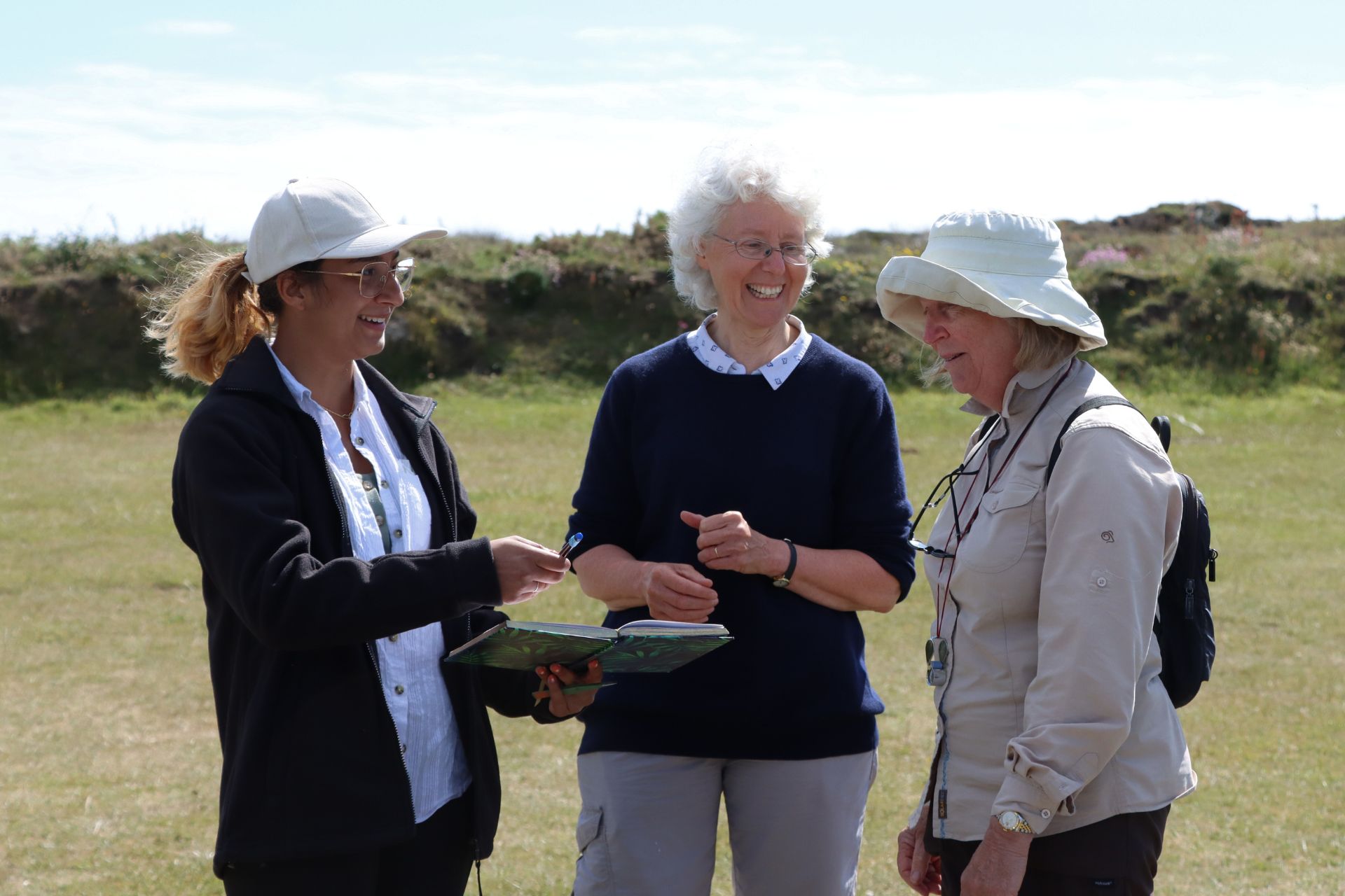 Expedition leaders encourage a local collector to provide their details for inclusion in research publications