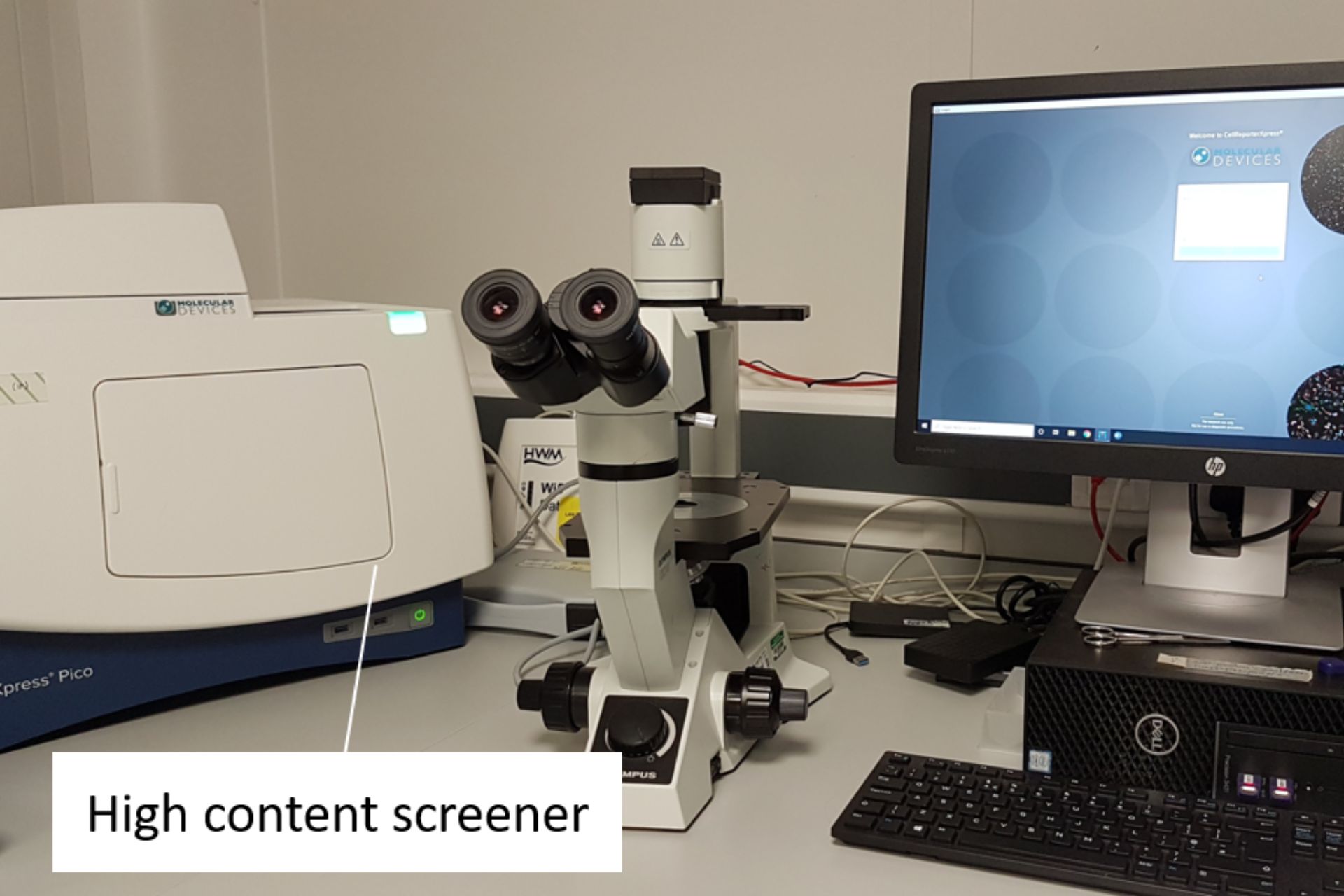 Lab equipment labelled 'high content screener'